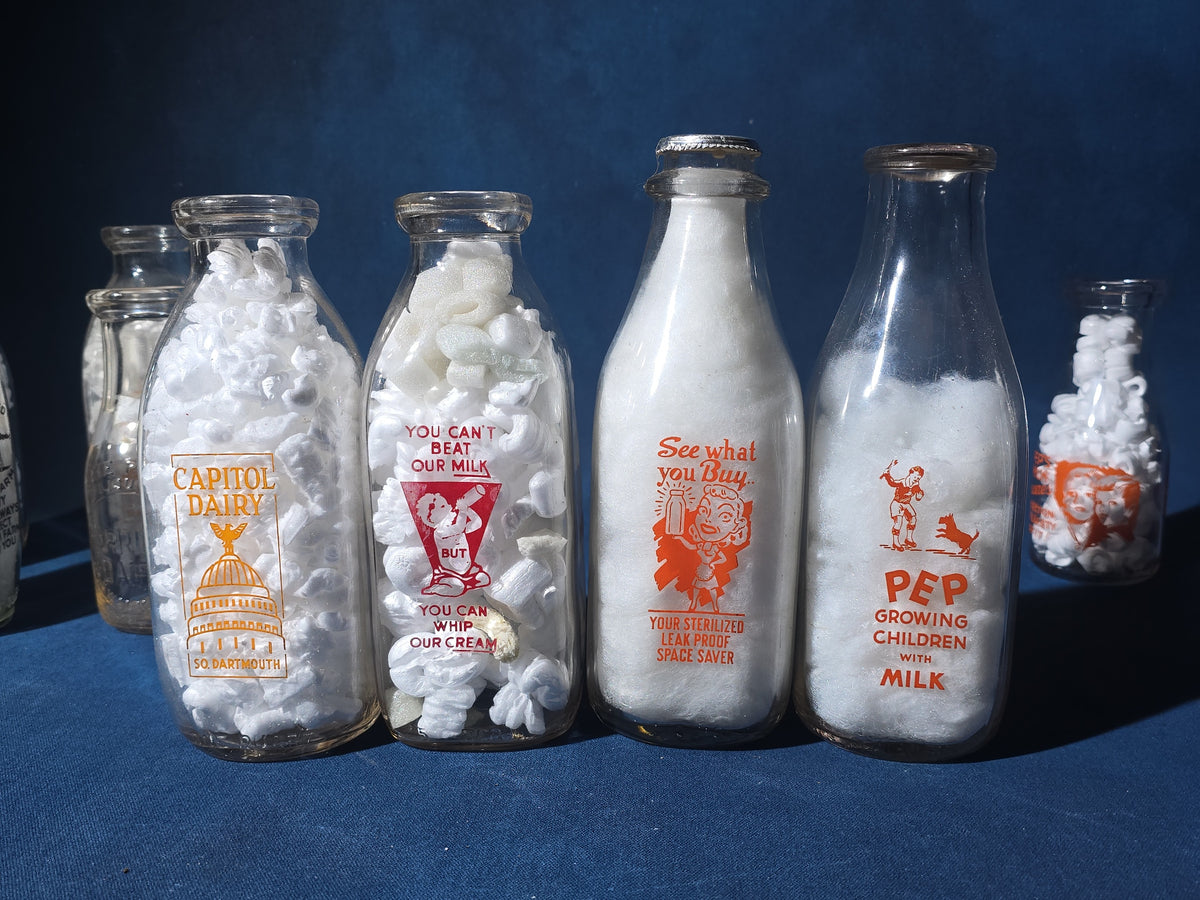 Grouping of 13 Vintage Printed Glass Dairy Milk Bottles including Capitol Dairy, Horst Dairy, Aroostook Farms, Sanford Dairy, Rice's, Findeisen's Farms, and Others