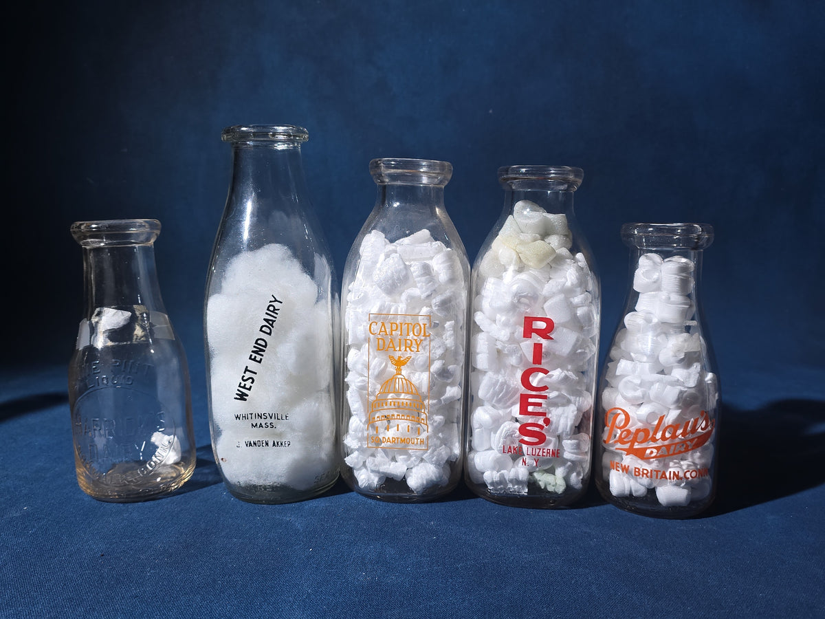 Grouping of 13 Vintage Printed Glass Dairy Milk Bottles including Capitol Dairy, Horst Dairy, Aroostook Farms, Sanford Dairy, Rice's, Findeisen's Farms, and Others