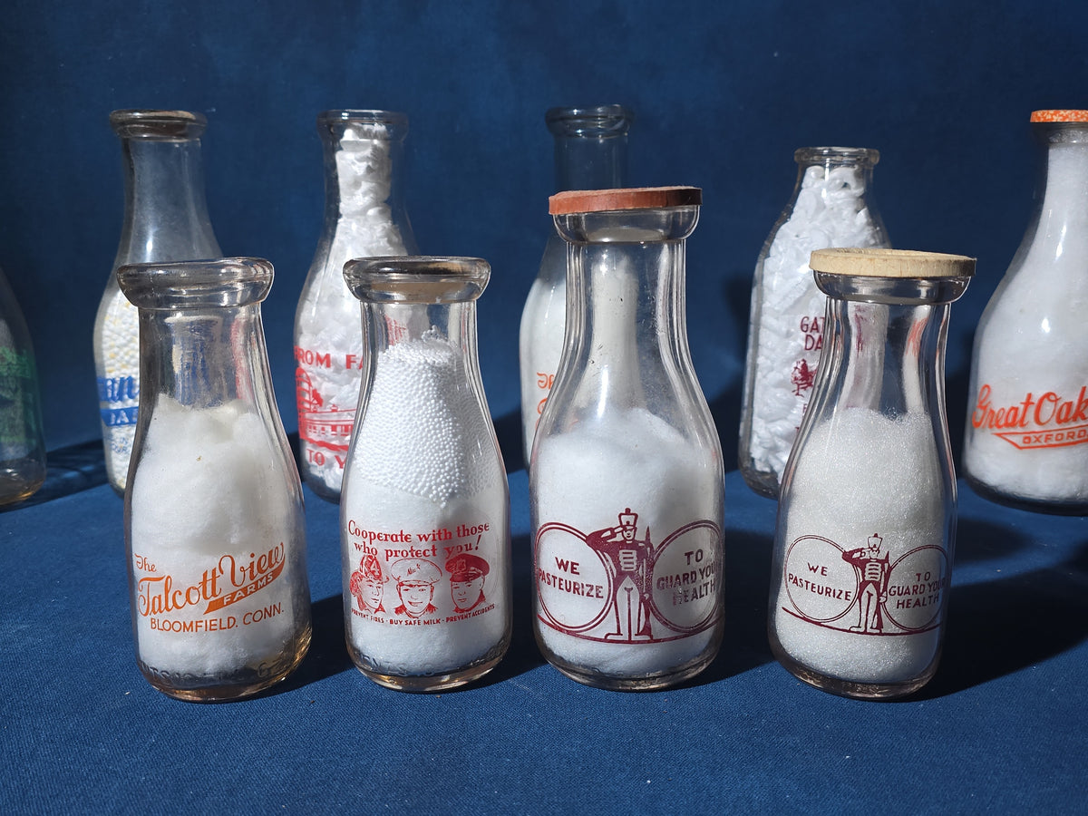Grouping of 14 Vintage Printed Glass Dairy Milk Bottles including Brownell Bros., Price's Farms Dairy, Talcott View Farms, Cashin's, and Great Oak Farm