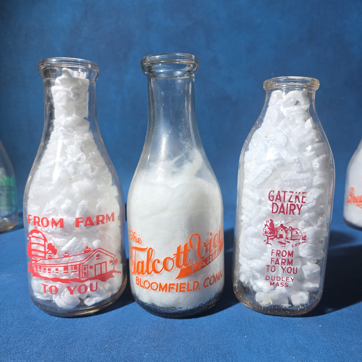 Grouping of 14 Vintage Printed Glass Dairy Milk Bottles including Brownell Bros., Price's Farms Dairy, Talcott View Farms, Cashin's, and Great Oak Farm