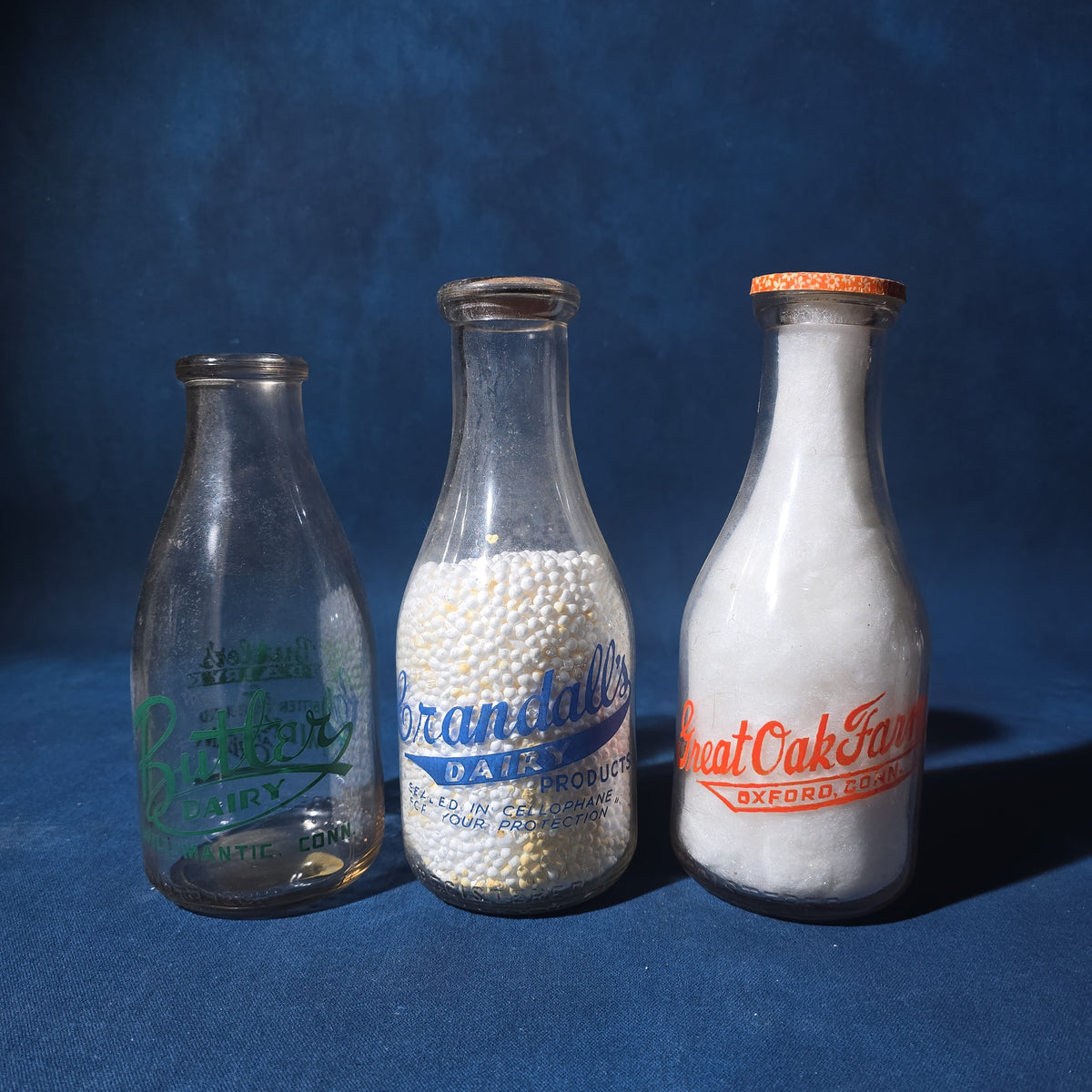 Grouping of 14 Vintage Printed Glass Dairy Milk Bottles including Brownell Bros., Price's Farms Dairy, Talcott View Farms, Cashin's, and Great Oak Farm