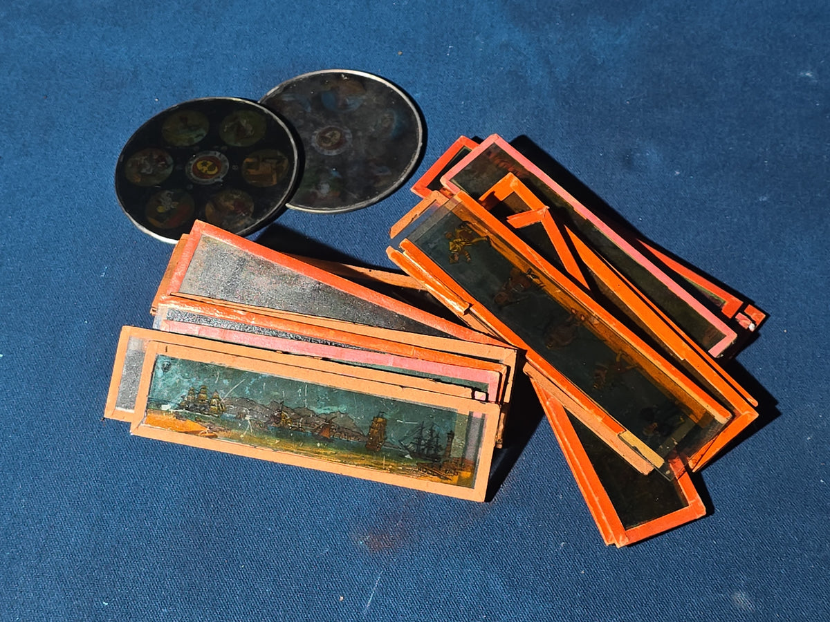 Grouping of 26 Antique Hand-Painted and Chromolithograph Magic Lantern Slides including Rectangular Slides and Round Reel Discs