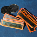 Lot 094 - Grouping of 26 Antique Hand-Painted and Chromolithograph Magic Lantern Slides Including Rectangular Slides and Round Reel Discs