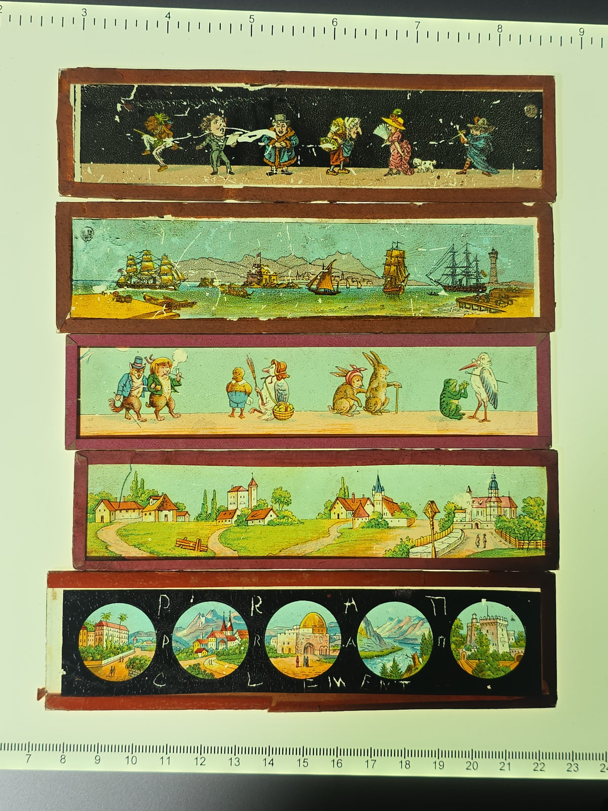 Grouping of 26 Antique Hand-Painted and Chromolithograph Magic Lantern Slides including Rectangular Slides and Round Reel Discs