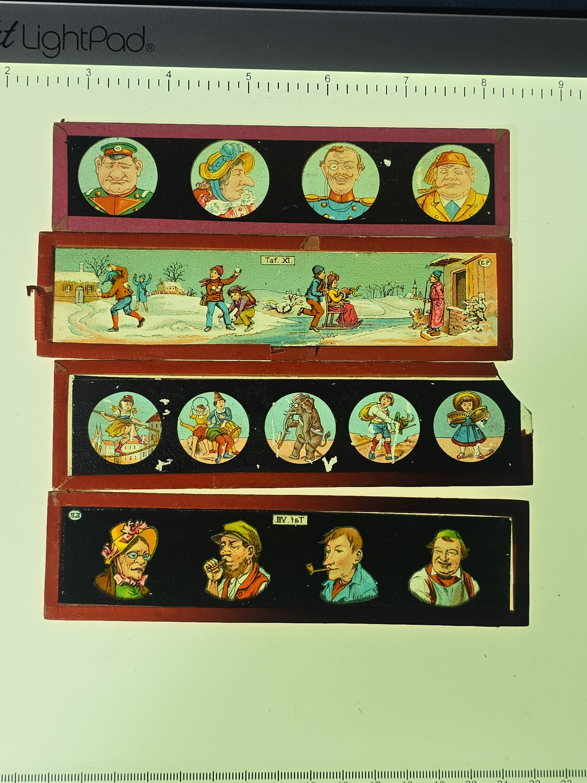 Grouping of 26 Antique Hand-Painted and Chromolithograph Magic Lantern Slides including Rectangular Slides and Round Reel Discs