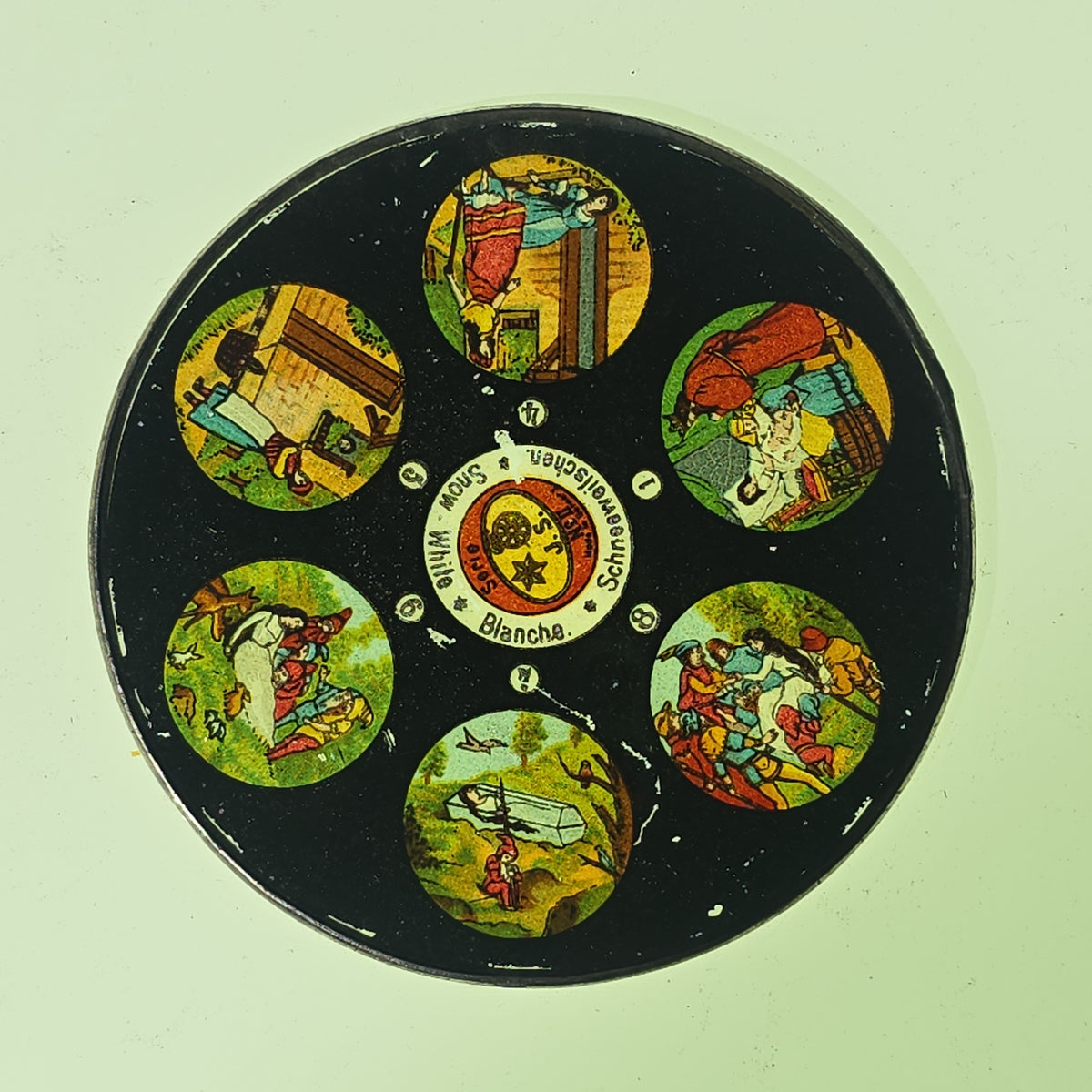 Grouping of 26 Antique Hand-Painted and Chromolithograph Magic Lantern Slides including Rectangular Slides and Round Reel Discs