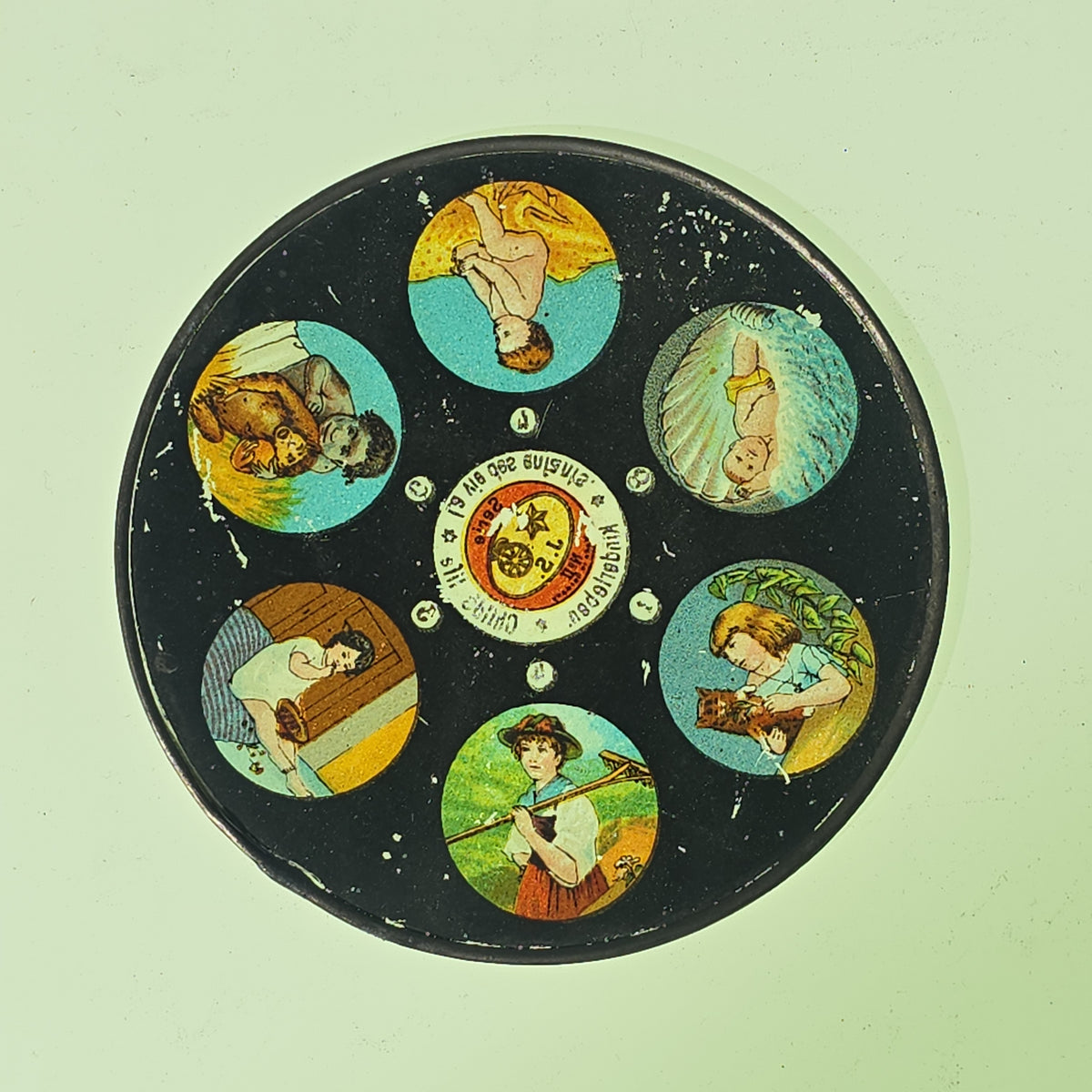 Grouping of 26 Antique Hand-Painted and Chromolithograph Magic Lantern Slides including Rectangular Slides and Round Reel Discs