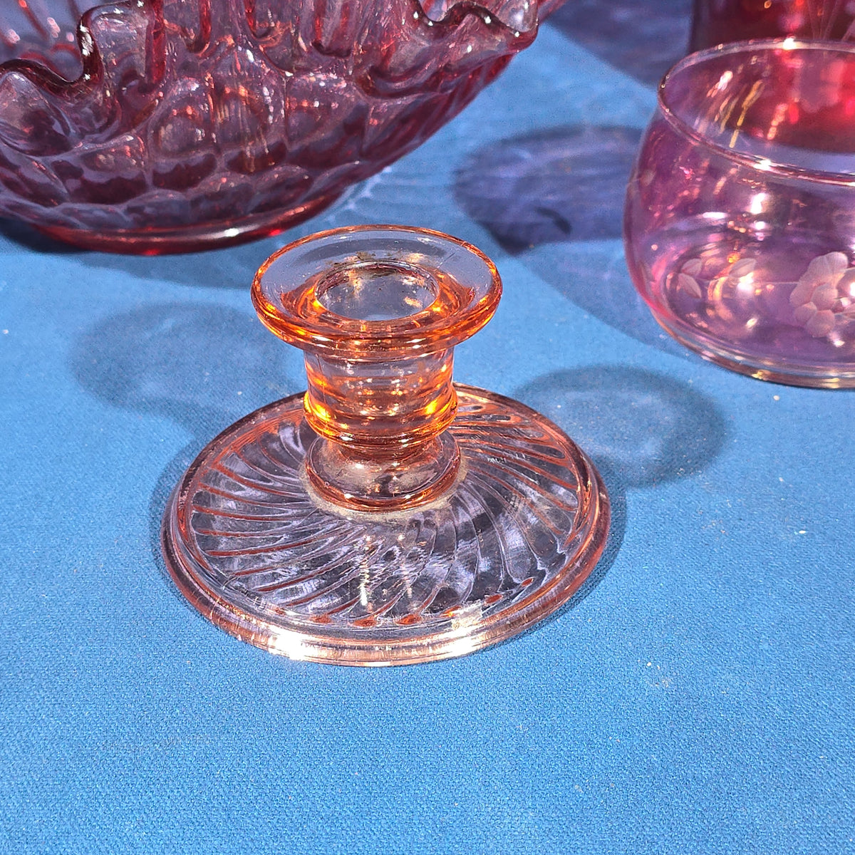 Grouping of Vintage Cranberry and Pink Glass including Ruffled Bowl, Decanter, Striped Bud Vase, Candleholder, and Lidded Jar