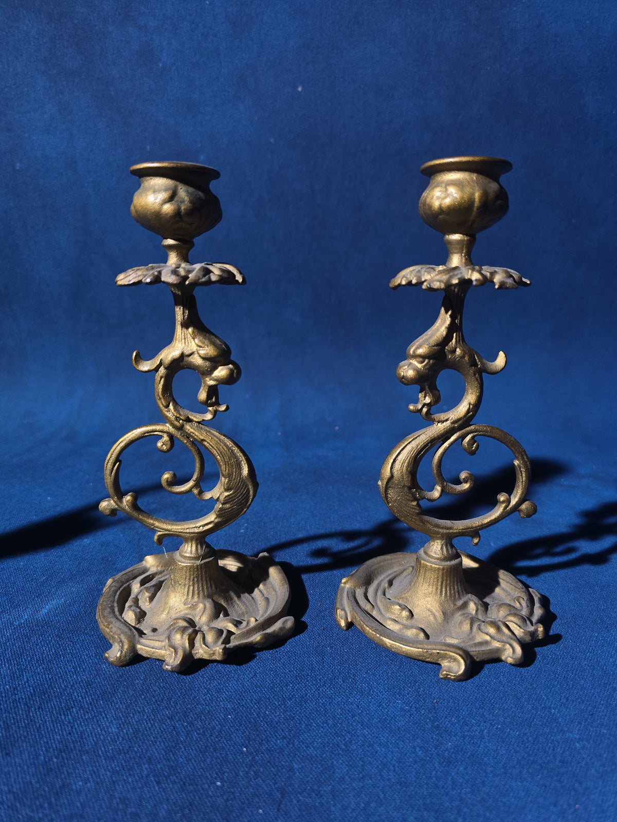 Grouping of Four Antique and Vintage Brass Candleholders including Crane on Turtle Figure, Three-Arm Candelabra, and Pair of Candlesticks