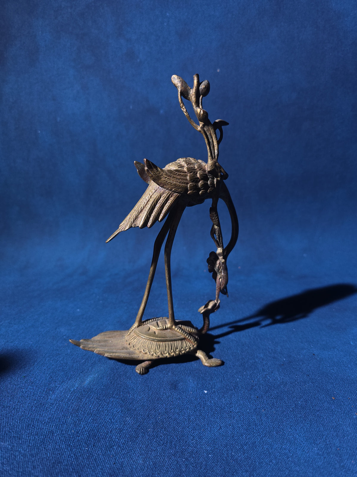 Grouping of Four Antique and Vintage Brass Candleholders including Crane on Turtle Figure, Three-Arm Candelabra, and Pair of Candlesticks