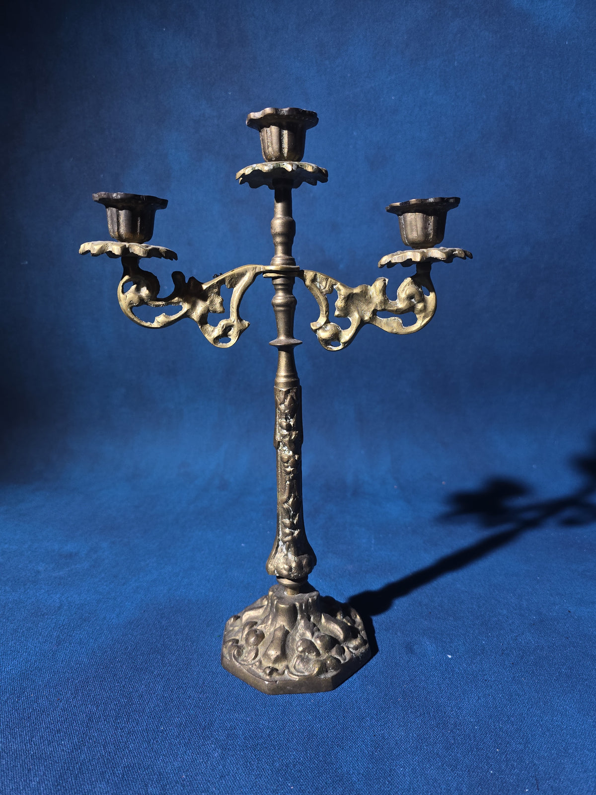 Grouping of Four Antique and Vintage Brass Candleholders including Crane on Turtle Figure, Three-Arm Candelabra, and Pair of Candlesticks