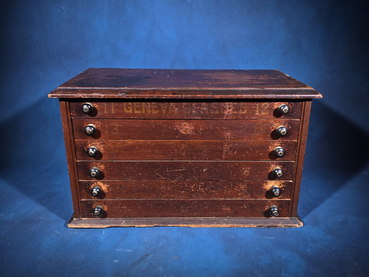 Antique Six-Drawer Spool Cabinet with Stenciled "Geneva" Lettering