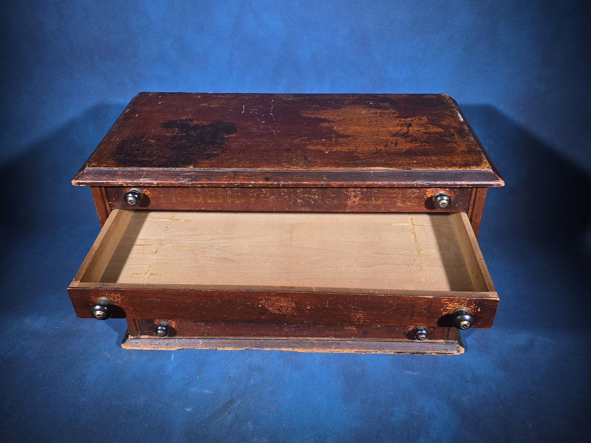 Antique Six-Drawer Spool Cabinet with Stenciled "Geneva" Lettering