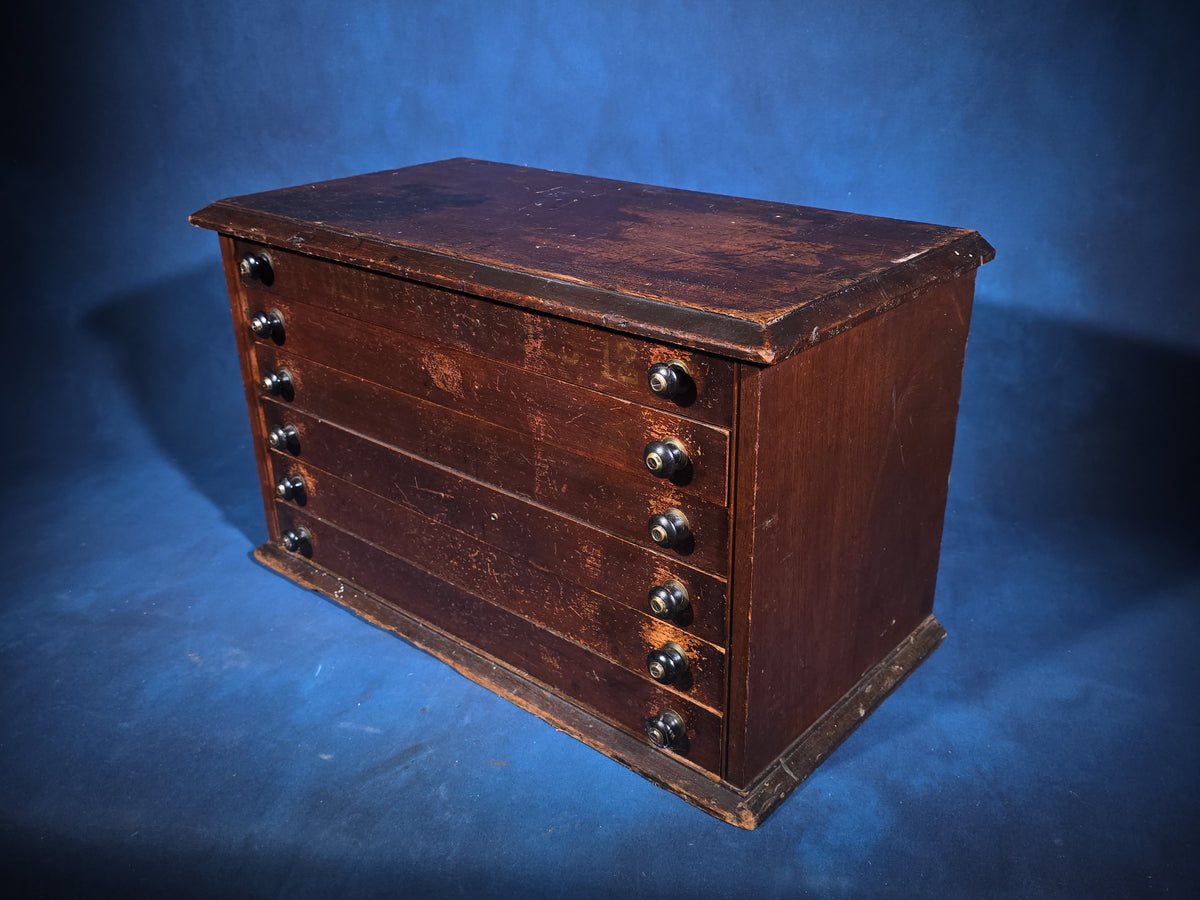 Antique Six-Drawer Spool Cabinet with Stenciled "Geneva" Lettering