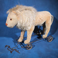 Lot 001 - Antique Stuffed Mohair Lion Pull Toy on Iron Wheel Base with Chain, 22" L x 17" H