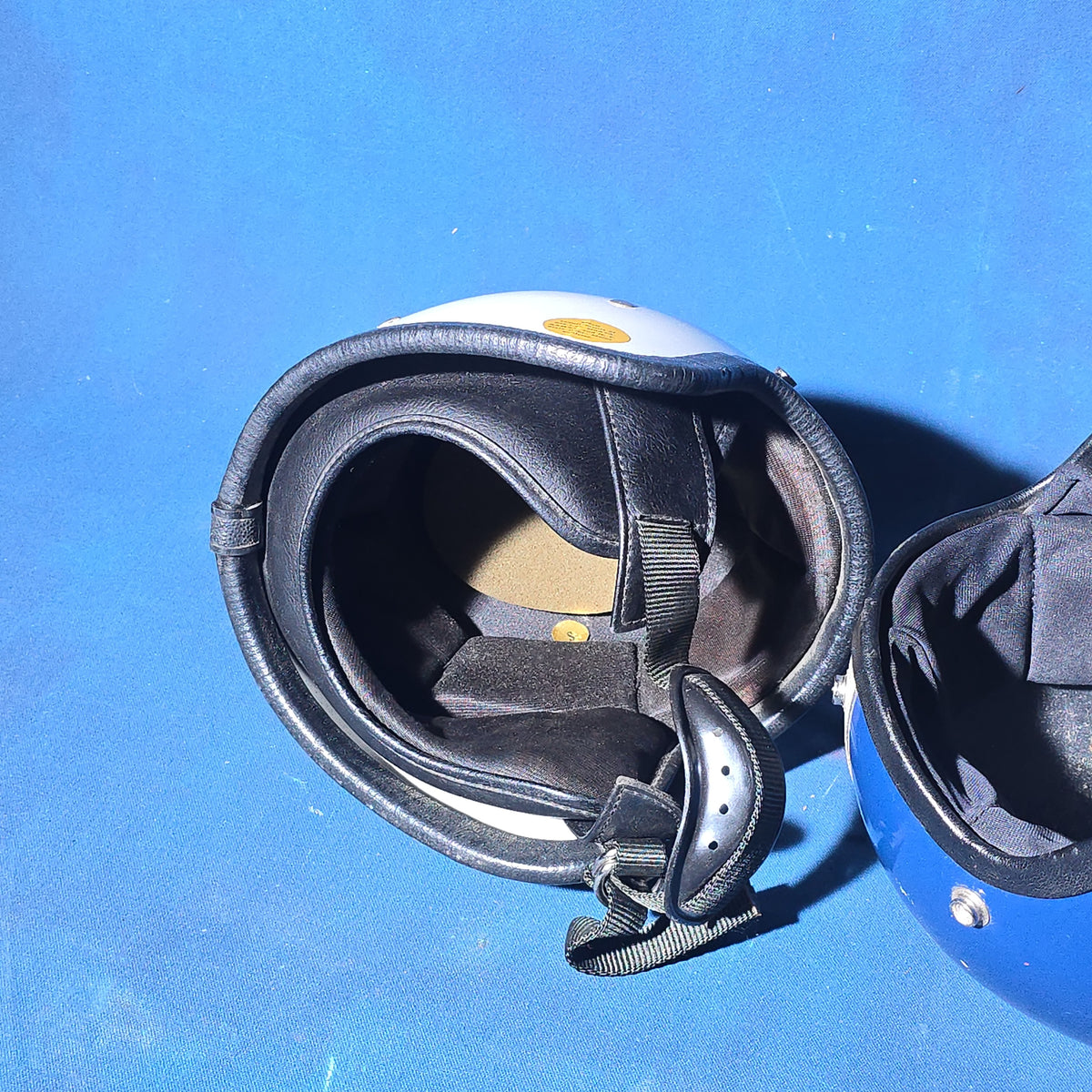 Pair of Vintage Open-Face Motorcycle Helmets, White with Black Stripe and Blue with Silver Stripe, Small
