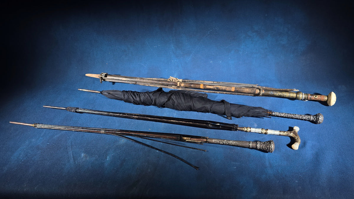 Grouping of Four Antique Parasols and Umbrellas with Ornate Handles including Mother of Pearl, 800 Silver, and Sterling Silver Examples