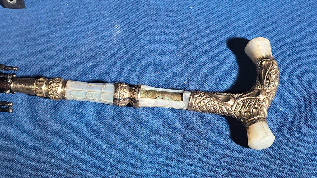 Grouping of Four Antique Parasols and Umbrellas with Ornate Handles including Mother of Pearl, 800 Silver, and Sterling Silver Examples