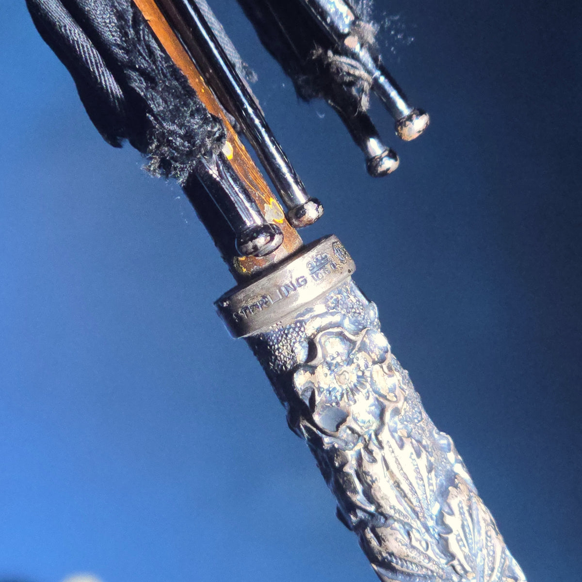 Grouping of Four Antique Parasols and Umbrellas with Ornate Handles including Mother of Pearl, 800 Silver, and Sterling Silver Examples