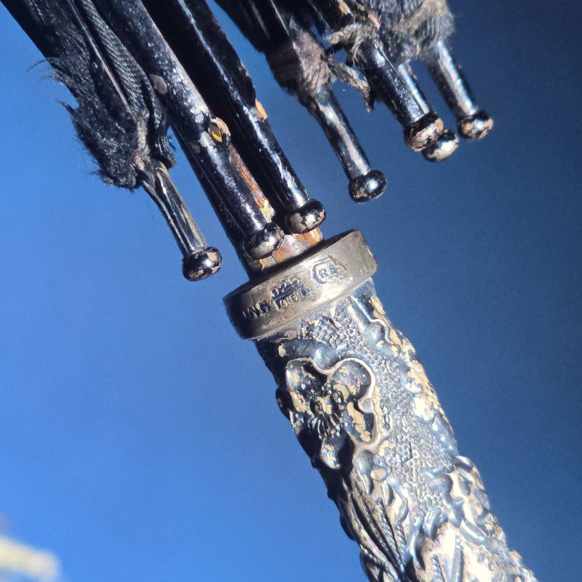 Grouping of Four Antique Parasols and Umbrellas with Ornate Handles including Mother of Pearl, 800 Silver, and Sterling Silver Examples