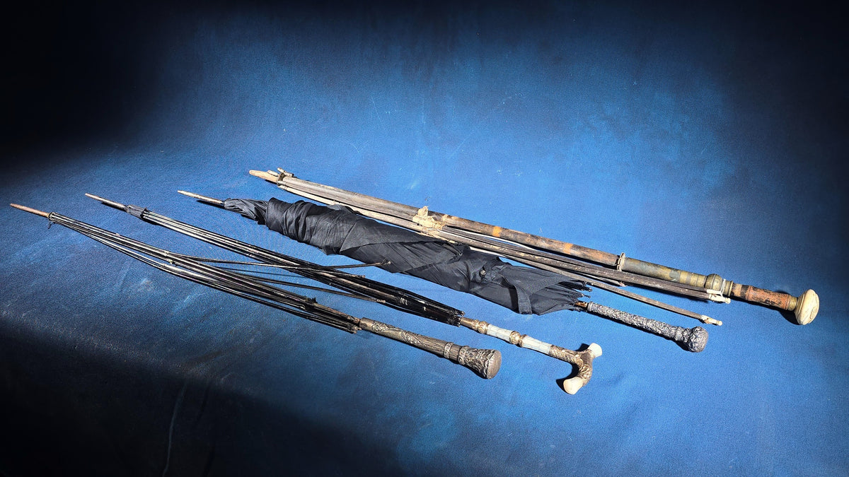 Grouping of Four Antique Parasols and Umbrellas with Ornate Handles including Mother of Pearl, 800 Silver, and Sterling Silver Examples