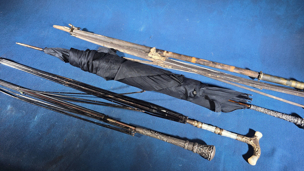 Grouping of Four Antique Parasols and Umbrellas with Ornate Handles including Mother of Pearl, 800 Silver, and Sterling Silver Examples