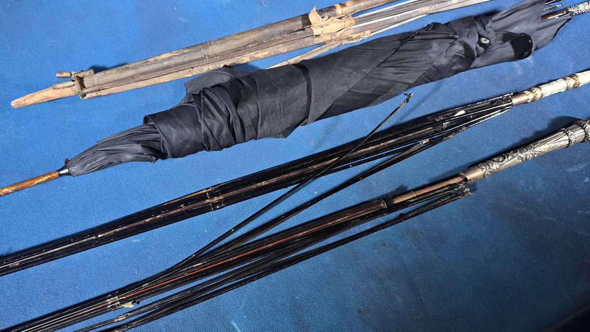 Grouping of Four Antique Parasols and Umbrellas with Ornate Handles including Mother of Pearl, 800 Silver, and Sterling Silver Examples