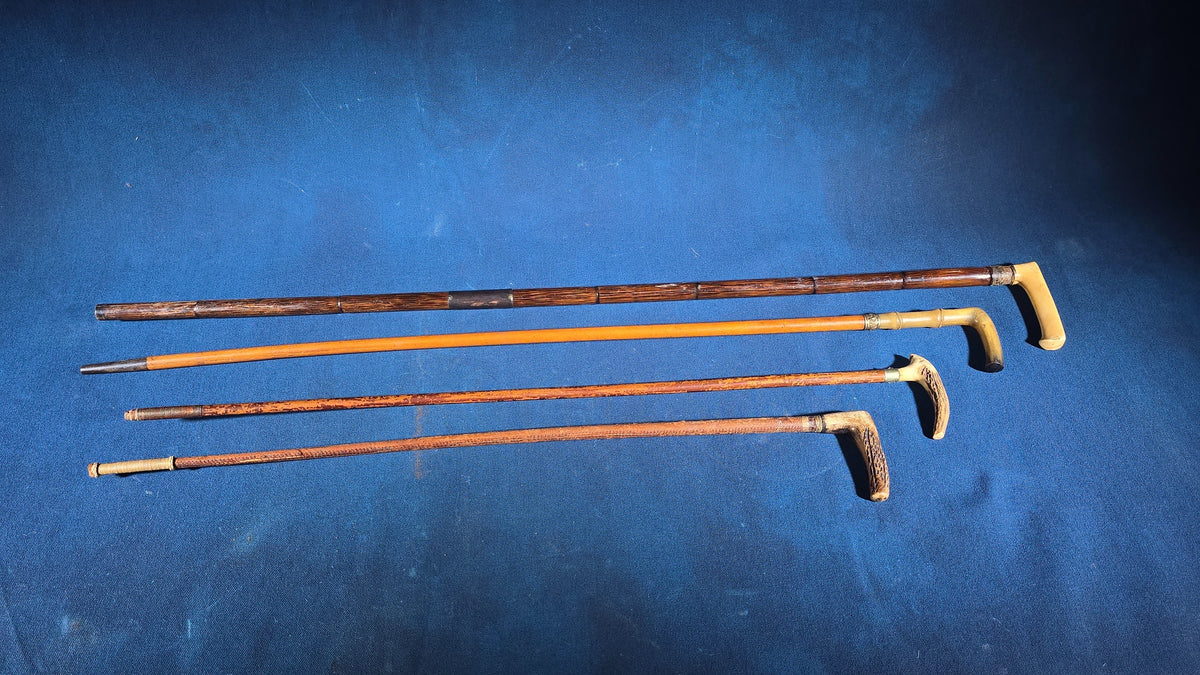 Grouping of Four Antique Walking Canes and Riding Crops including Bone-Handled, Horn-Handled, and Leather-Wrapped Examples