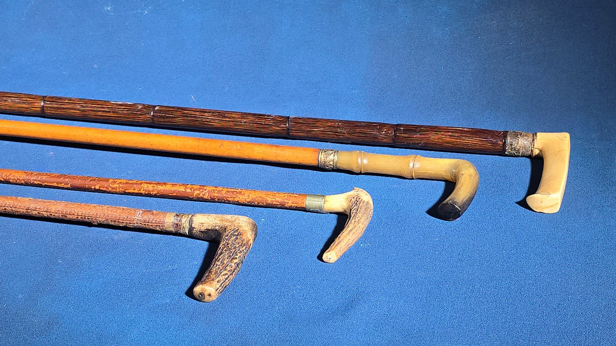 Grouping of Four Antique Walking Canes and Riding Crops including Bone-Handled, Horn-Handled, and Leather-Wrapped Examples