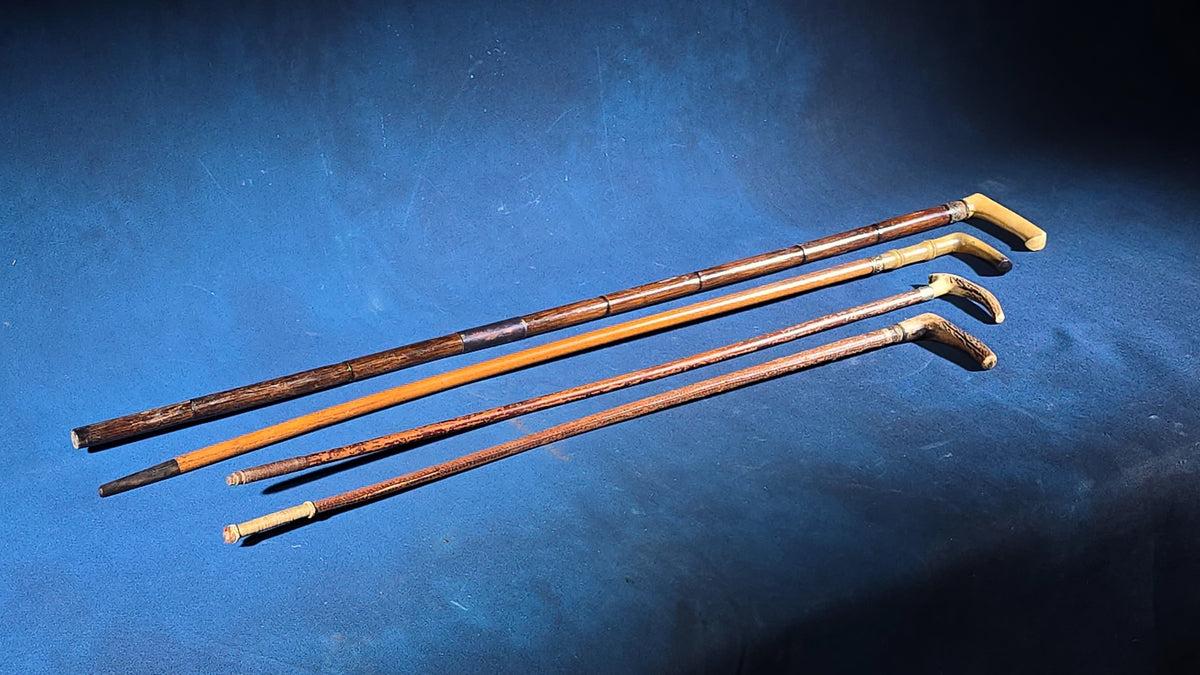 Grouping of Four Antique Walking Canes and Riding Crops including Bone-Handled, Horn-Handled, and Leather-Wrapped Examples