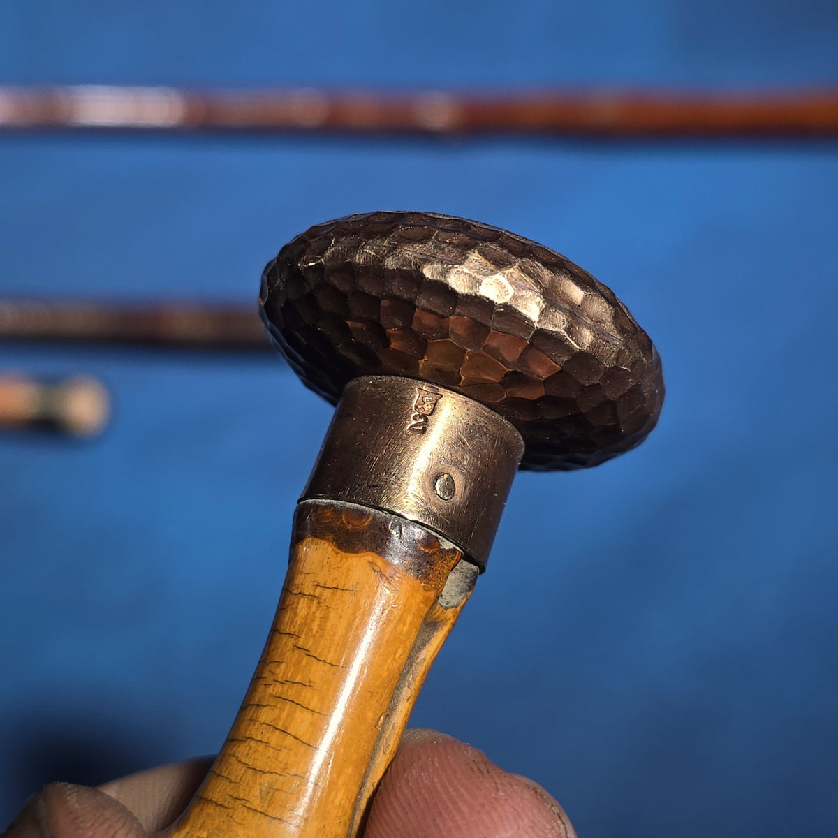Grouping of Four Antique Walking Canes including Bamboo Cane with Hammered Metal Knob Handle and Engraved Monogram, Burl Wood Cane, and Leather-Wrapped Cane