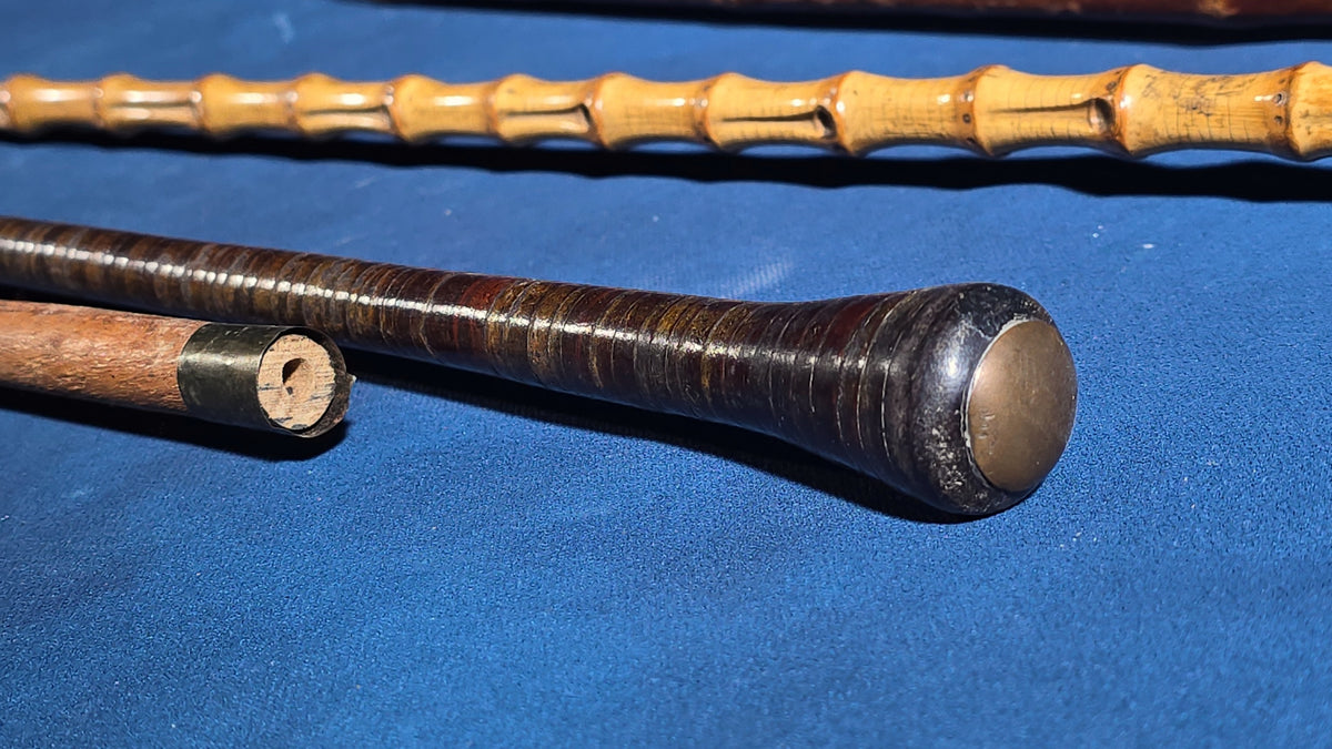 Grouping of Four Antique Walking Canes including Bamboo Cane with Hammered Metal Knob Handle and Engraved Monogram, Burl Wood Cane, and Leather-Wrapped Cane