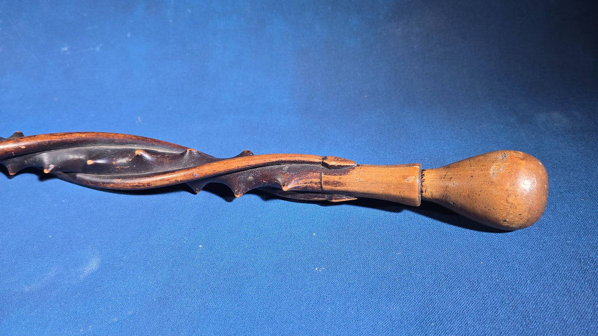 Trio of Antique Walking Canes including Carved Twisted Wood, Bamboo with Tiger's Eye Ball Top, and Ivory-Topped Ebony