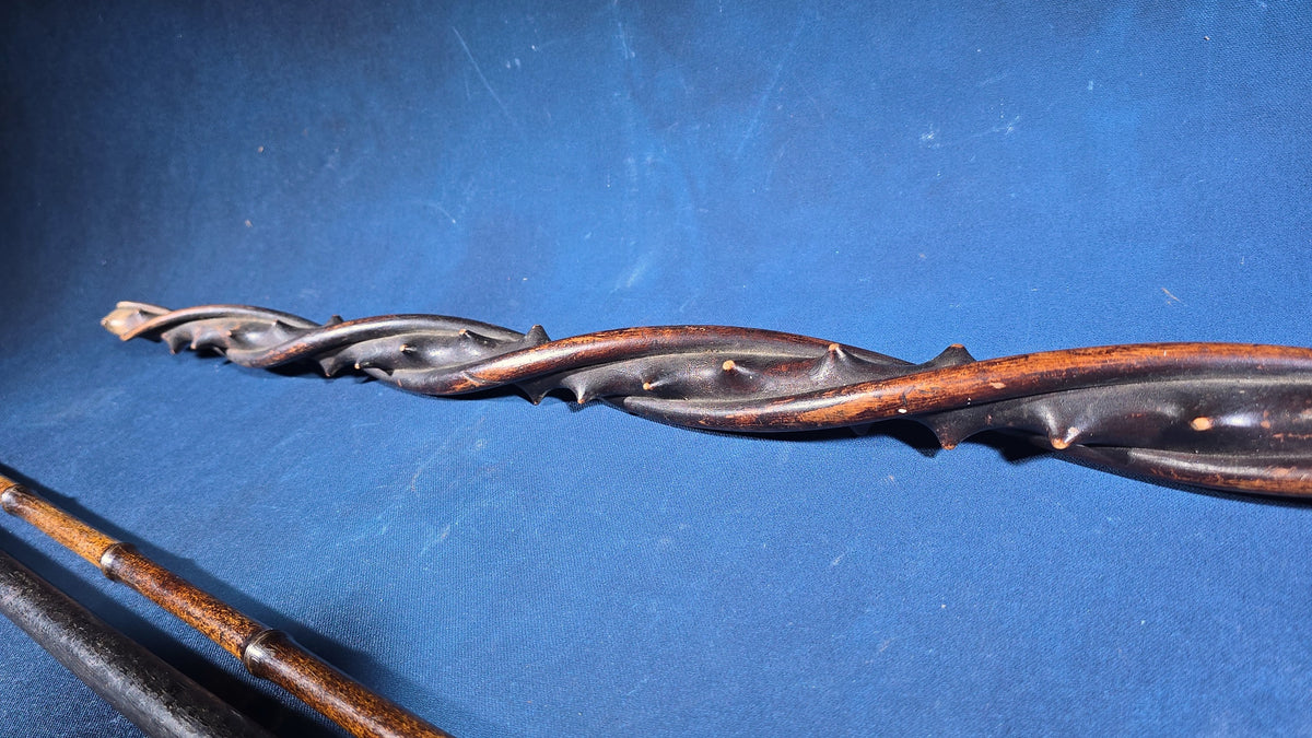 Trio of Antique Walking Canes including Carved Twisted Wood, Bamboo with Tiger's Eye Ball Top, and Ivory-Topped Ebony