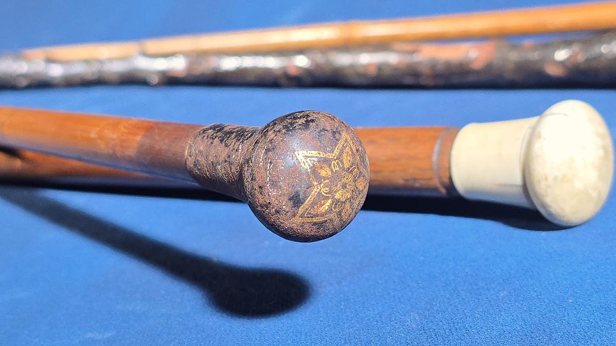 Grouping of Four Antique Walking Canes including Knotted Wood with Monogrammed Sterling Silver Knob, Bamboo with Glass-Topped Compass Handle, and Bone-Topped Wooden Cane