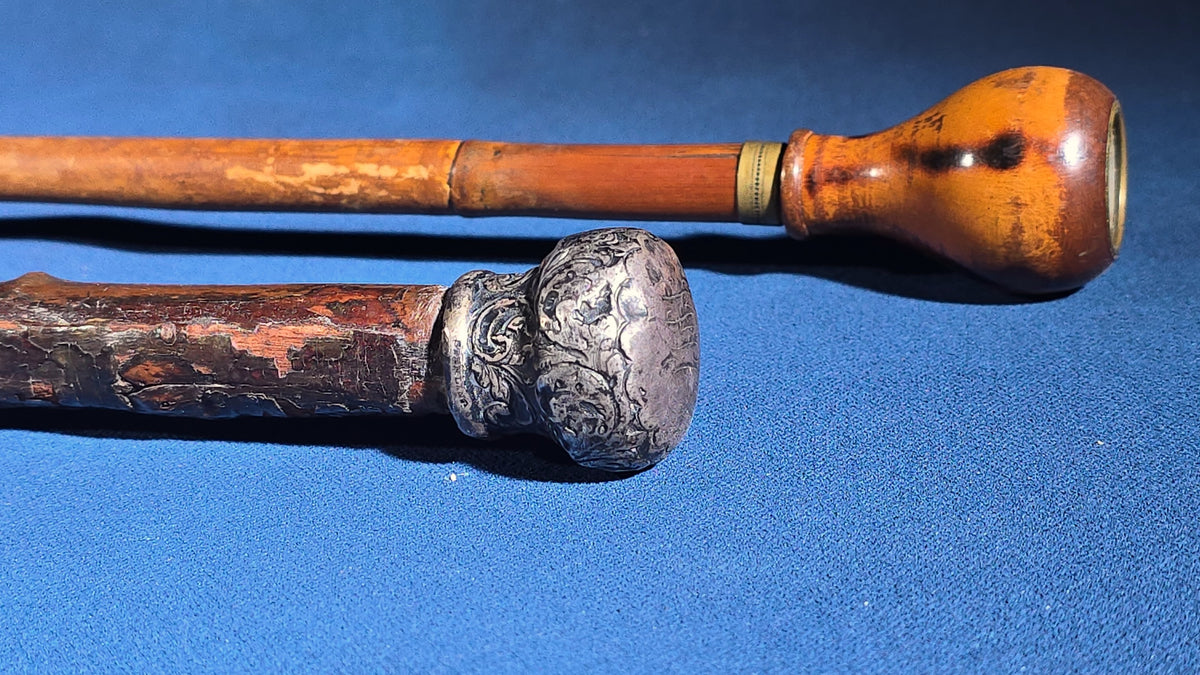 Grouping of Four Antique Walking Canes including Knotted Wood with Monogrammed Sterling Silver Knob, Bamboo with Glass-Topped Compass Handle, and Bone-Topped Wooden Cane