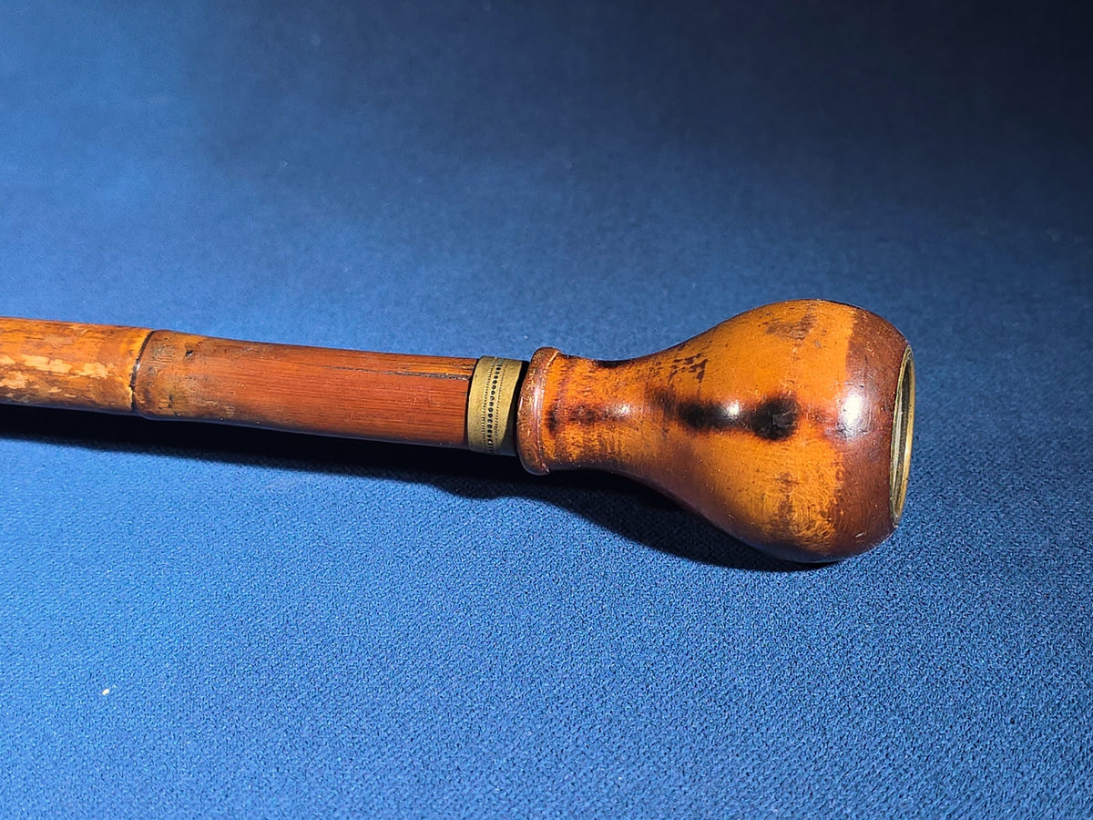 Grouping of Four Antique Walking Canes including Knotted Wood with Monogrammed Sterling Silver Knob, Bamboo with Glass-Topped Compass Handle, and Bone-Topped Wooden Cane