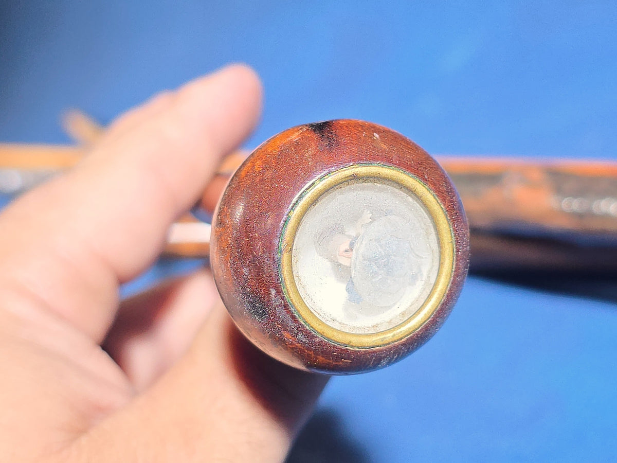 Grouping of Four Antique Walking Canes including Knotted Wood with Monogrammed Sterling Silver Knob, Bamboo with Glass-Topped Compass Handle, and Bone-Topped Wooden Cane