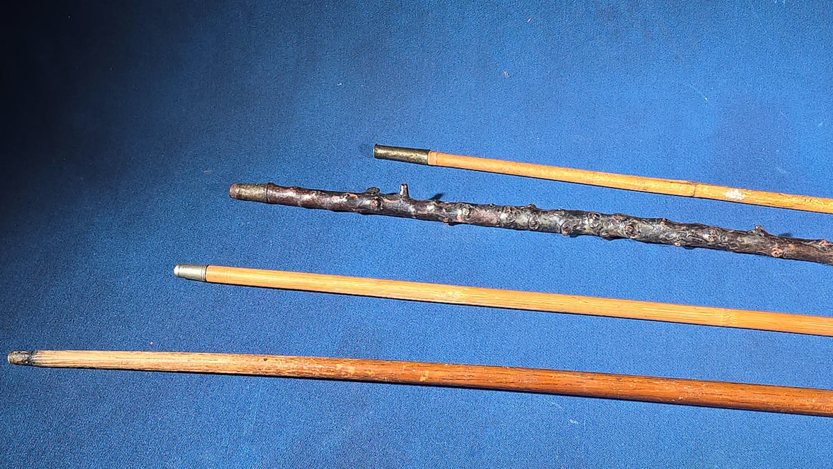 Grouping of Four Antique Walking Canes including Knotted Wood with Monogrammed Sterling Silver Knob, Bamboo with Glass-Topped Compass Handle, and Bone-Topped Wooden Cane