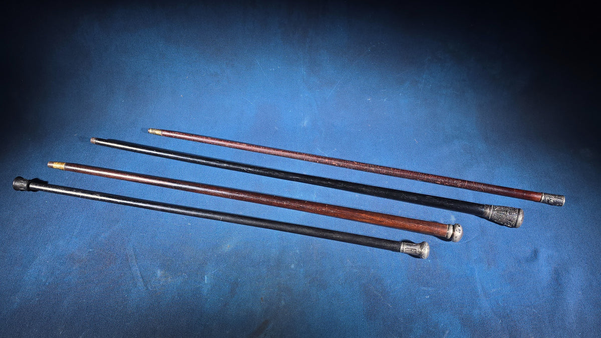 Grouping of Four Antique and Vintage Walking Canes including Sterling Silver-Topped and Metal-Topped Examples