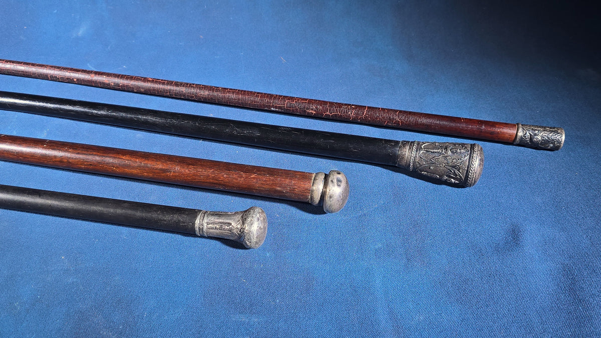 Grouping of Four Antique and Vintage Walking Canes including Sterling Silver-Topped and Metal-Topped Examples