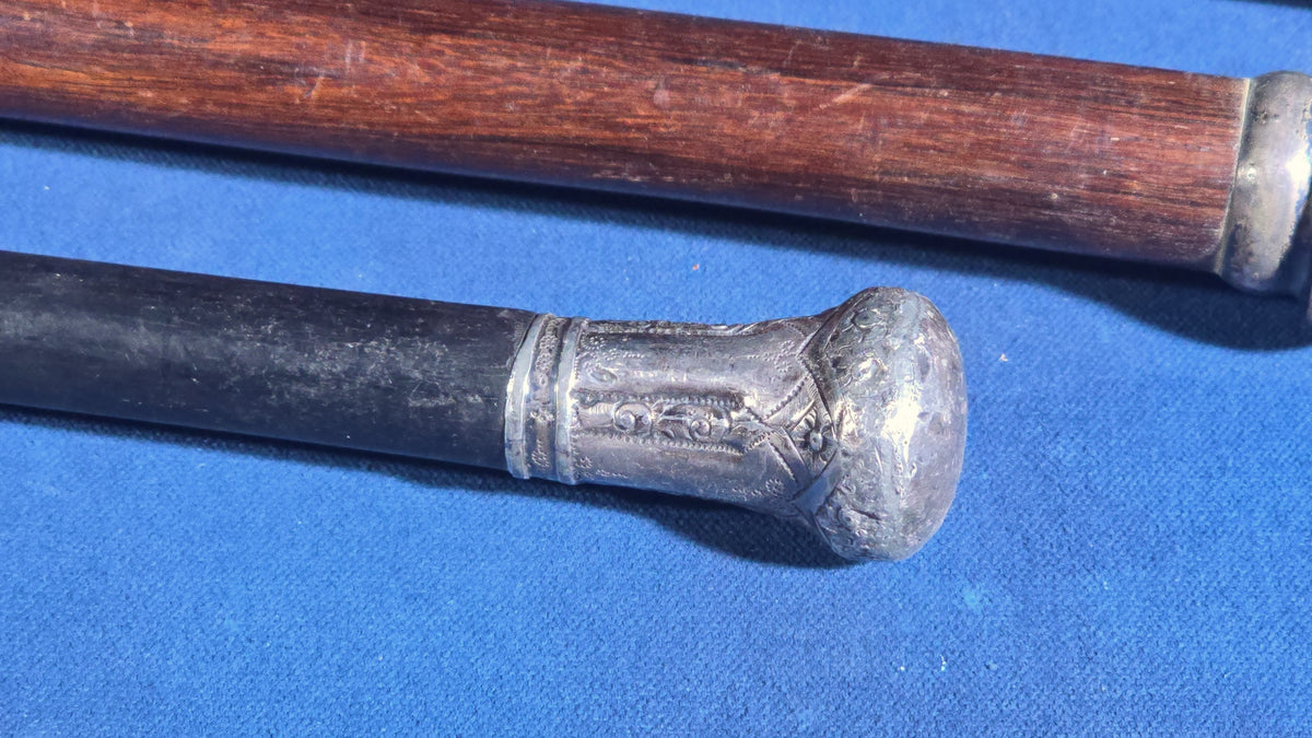 Grouping of Four Antique and Vintage Walking Canes including Sterling Silver-Topped and Metal-Topped Examples