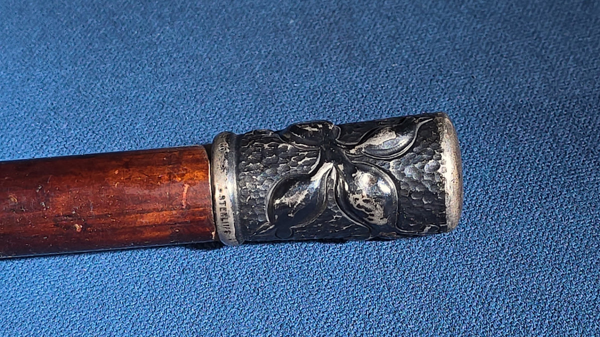 Grouping of Four Antique and Vintage Walking Canes including Sterling Silver-Topped and Metal-Topped Examples