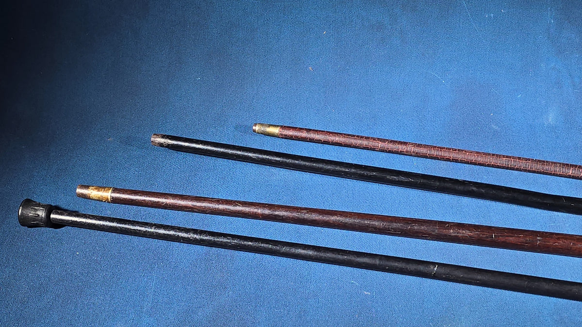 Grouping of Four Antique and Vintage Walking Canes including Sterling Silver-Topped and Metal-Topped Examples