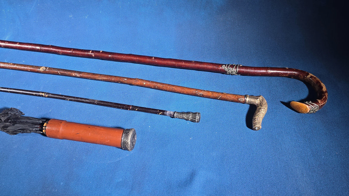 Grouping of Four Antique Walking Canes and Parasol Cane with Metal Handles