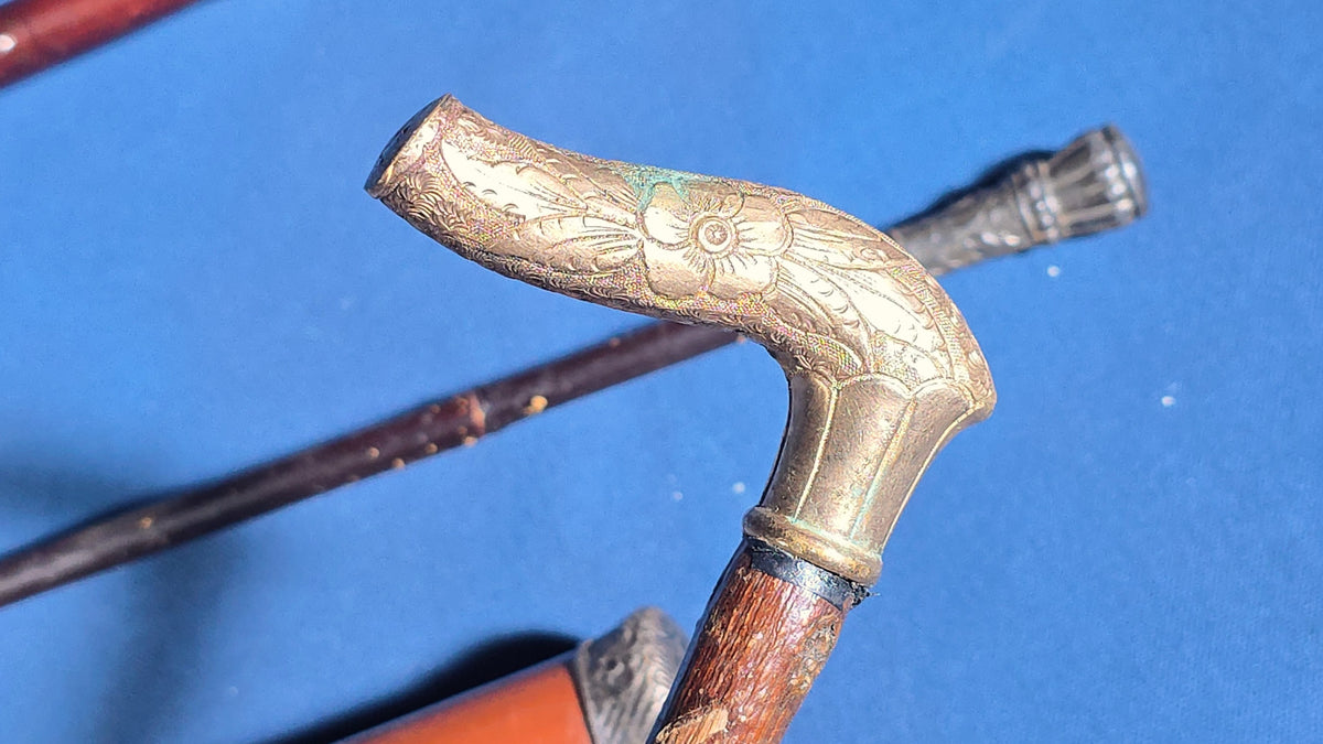Grouping of Four Antique Walking Canes and Parasol Cane with Metal Handles