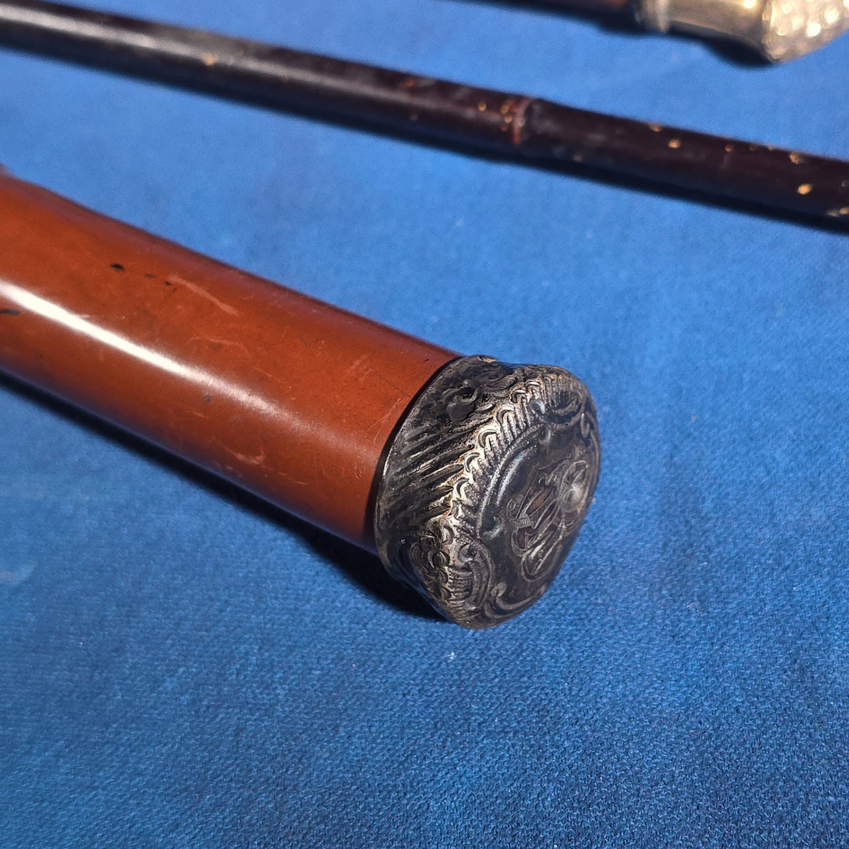 Grouping of Four Antique Walking Canes and Parasol Cane with Metal Handles