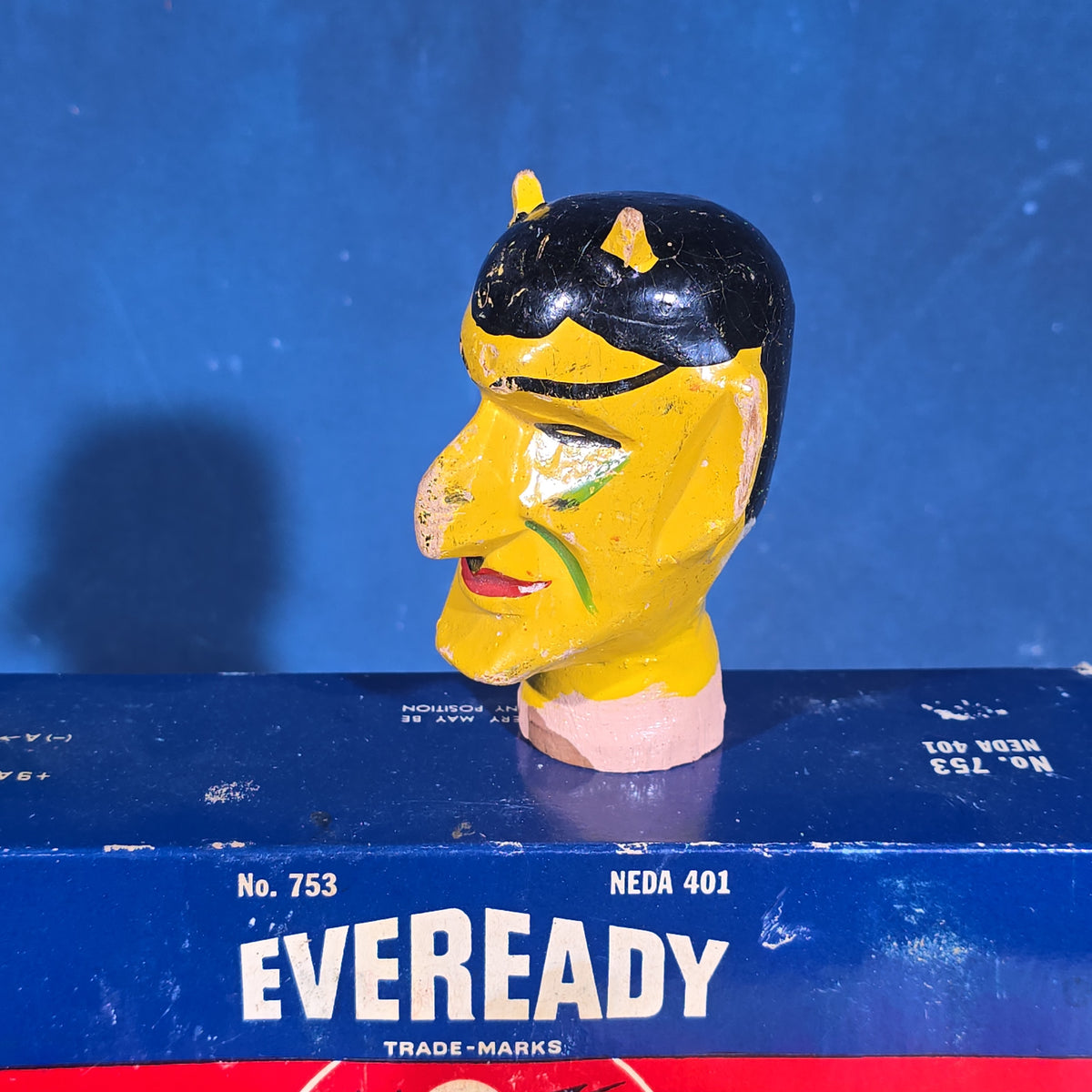 Grouping of Vintage Smalls including Eveready Nine Lives Batteries, Cast Metal Toy Cars, Carved Wooden Devil Head, and Postcards