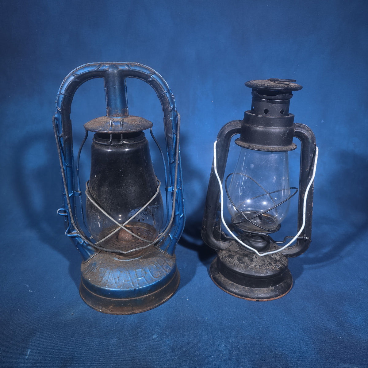 Pair of Vintage Kerosene Barn Lanterns including Dietz Monarch and Lamplight Farms