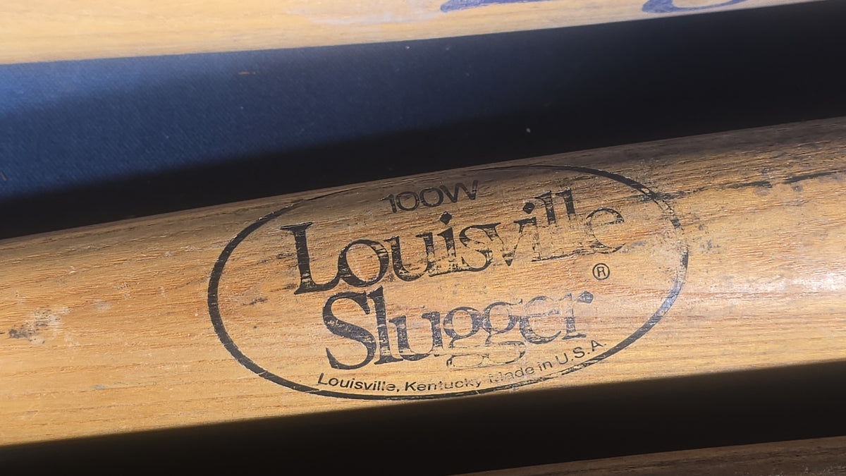 Grouping of Five Vintage Wood Softball Bats including Louisville Slugger and Official Lightning
